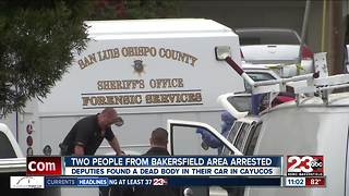 Two people arrested for having a dead body in their car