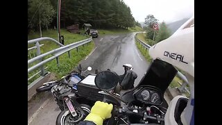 Bikers Topple on Rain Slick Bridge