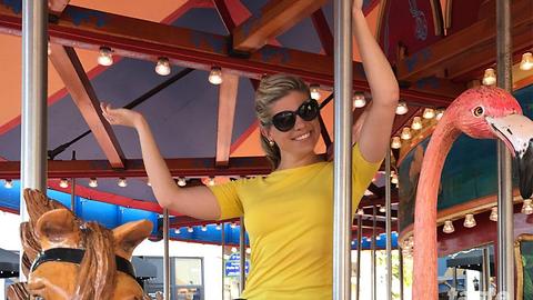 WPTV personalities ride a Merry-Go-Round