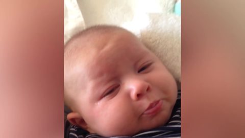 A Baby Boy Frowns When His Mom Asks Him To Smile