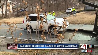 Water main break sinks car in the Northland
