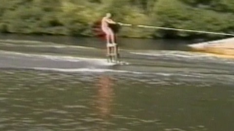 A Water Skier Loses Control After Running Into A Rubber Dinghy