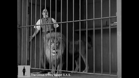 Charlie Chaplin with a lion