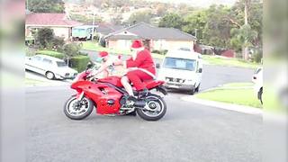 "Santa Falls Off Red Motorcycle"