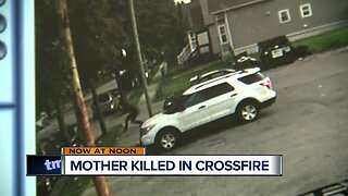 Surveillance footage shows how a mother of 2 was caught in the crossfire
