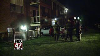 Car crashes into Lansing apartment