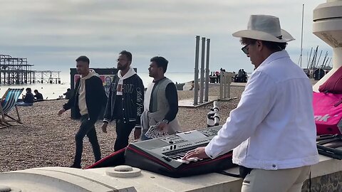 Live music on the beach with Donnie Max playing & mixing the keyboards. Busking in Brighton.