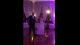 Bride and groom perform choreographed first dance