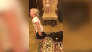 Tot Girl Loses Tug Of War With Dog