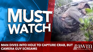 Man Dives Into Hole To Capture Crab, But Camera Guy Screams