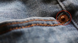 Circular Metal Pieces Around Jean Pockets Actually Have An Important Purpose