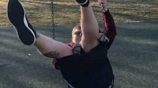 Dad falls from swing with baby boy in his lap!