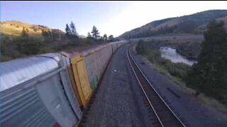 Drone races moving freight train