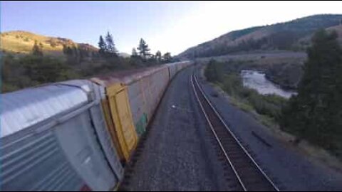 Drone races moving freight train