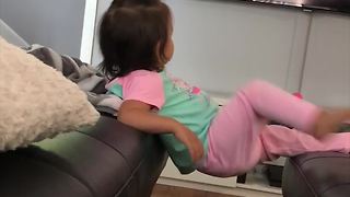 Cute Girl Falls While Watching Cartoons