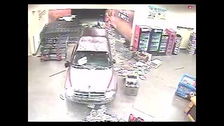Suspects crash into store to steal 21 guns