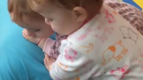 Sound Asleep Grandpa Keeps Twins Entertained