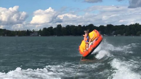 Epic wipeout: Kid gets flipped over while riding waterski tube