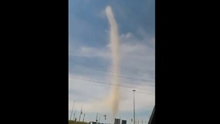 Driver captures close range footage of massive dust devil