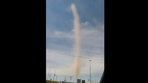 Driver captures close range footage of massive dust devil