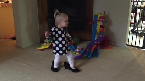 Little Girl Walks Around In Mommy's Shoes