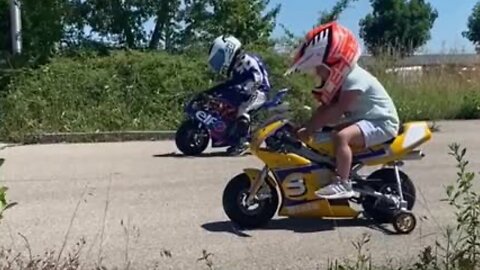 Siblings Adorably Race Each Other On Motor Bikes
