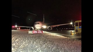 Plane slides off Taxiway at DIA
