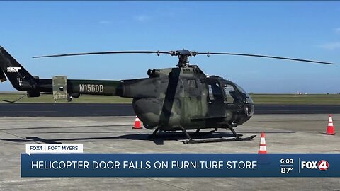 Helicopter door falls onto furniture store's roof