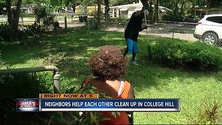 Neighbors help each other clean up after Irma