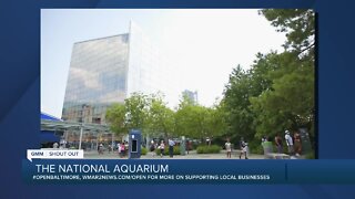 The National Aquarium says "We're Open Baltimore!"