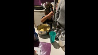 Daughter learning to make cupcake