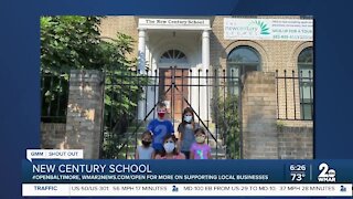 New Century School in Fells Point says "We're Open Baltimore!"