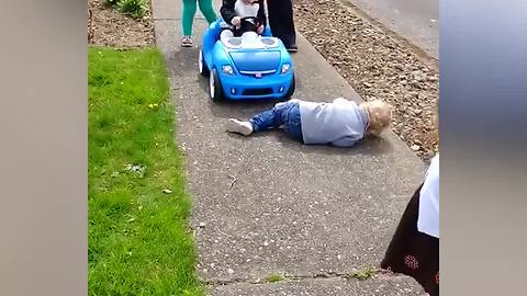 Little Boy Pretends To Be Hit By a Toy Car