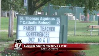 Community upset over swastika painting on school