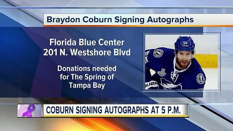Lightning defenseman Braydon Coburn signing autographs to support local domestic violence shelter