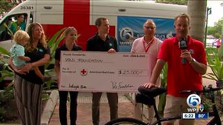 Day 3 of Steve Weagle Ride for the Red Cross: Receiving donation from Volo Foundation