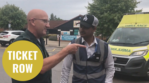 Shocking moment a ticket warden fines an ambulance for parking on double yellows