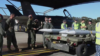 U.S Marines and Australian Airmen load Missiles on Joint Strike Fighters together