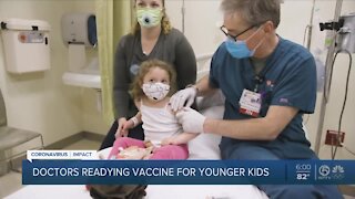 Doctors prepare to vaccinate young children