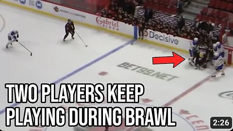 Hockey players go one on one while their teammates fight, a breakdown