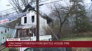 Cincinnati firefighters battle house fire
