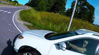 Motorist in roundabout almost hits bicyclist