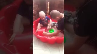 Cute Kids Play In Baby Pool