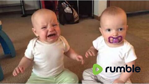 Twin baby girls fight over pacifier