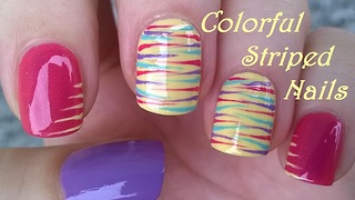 Easy striped nail design over pink & yellow nails