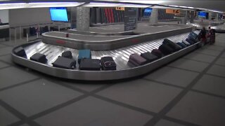 Woman's luggage stolen from carousel at Denver International Airport