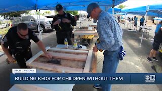 Valley volunteers building bed for kids