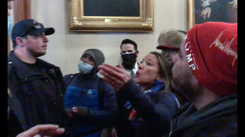 Ashli Babbitt gives water to Capitol Police Officers moments before being MURDERED