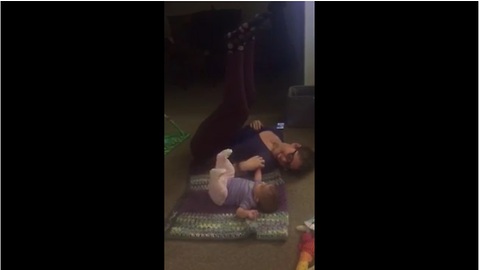 Baby works out with mom, mimics her moves