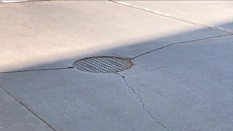 Driving You Crazy: Why do some streets have manhole covers right in the path of your tires?